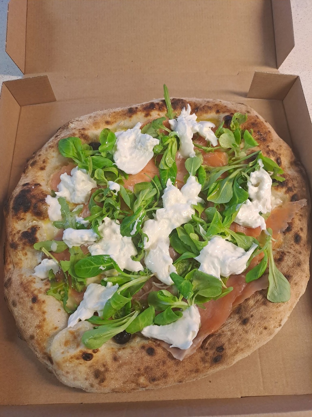 Pizza préparée par Pizza Napoli